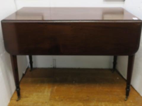 Mahogany Drop Leaf Table with Single Drawer:: Mahogany Drop Leaf Table with Single Drawer: Beveled Edge Table has Single Drawer on One End and Faux Drawer on Other. Hand Cut Dove Tails on Drawers. Turned, Tapering Legs to Brass Casters. Brass Rin