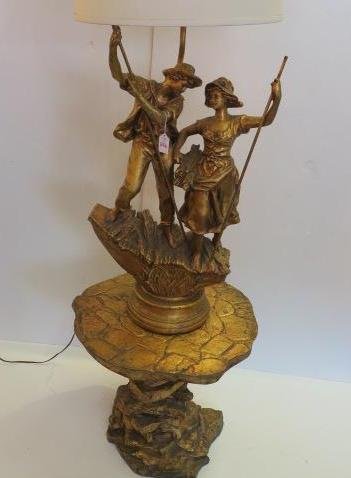3 Pc. French Figural Lamp, Electrified with Pedestal:: 3 Pc. French Figural Lamp, Electrified with Pedestal: Composition Model Male and Female Holding Poles Standing on Reed Base and Round Plinth. Mounted on Simulated Rock 18"T Pedestal Table. Lamp is 52"