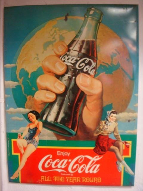 1932 "All the Year 'Round-Metal Coca-Cola Sign:: 1932 "All the Year 'Round-Metal Coca-Cola Sign: Depicts Gloved Hand Holding a Bottle of Coke with Lupe Velez Sitting on Either Side of Sign. Beveled Edges. Some Scuffing and Rust. 33" X 24". (200-400)