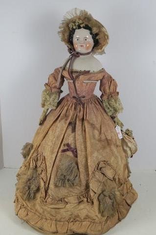 China Head Doll with Leather Arms:: China Head Doll with Leather Arms: Flat Top Head with Black Hair in Civil War Hairstyle, High Brow, Hand painted Molded Features and Brown Eyes. China Shoulder Plate, Leather Arms and Hands with Cloth
