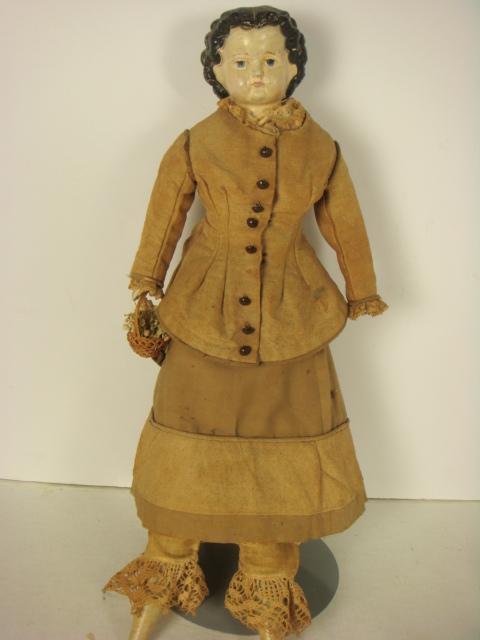 Papier Mache Head and Shoulder Plate Doll:: Papier Mache Head and Shoulder Plate Doll: Molded, Painted Face and Hair in Style of China Head Doll. High Brow, Parted Hair in Sausage Curls Framing Face. Cloth Body in Original Costume. Late 1800's 