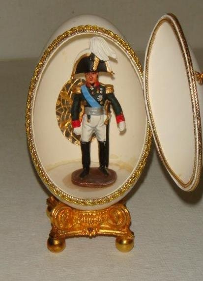 CARTIER Vermeil Mounted Goose Egg with General, 5" T.:: CARTIER Vermeil Mounted Goose Egg with General, 5" T.: Marked CARTIER STERLING with Gold Wash Mounted Goose Egg with Door opening to Reveal Napoleonic General inside. 54mm Hand painted Model Lead Sold