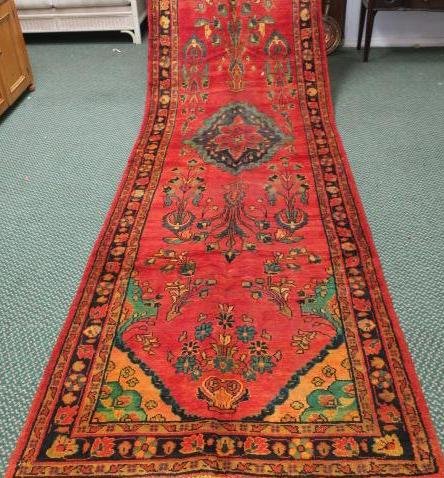 Hand loomed Wool Iranian Baluch Runner:: Hand loomed Wool Iranian Baluch Runner: Classic Rug with 3 Banded Border, The Main Having Repeating Flower Heads. Center Medallion on Red Ground with Vase of Flowers at Each End and Symmetrical Flower