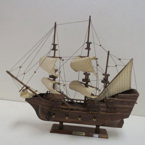 Wooden Model of "MAYFLOWER":: Wooden Model of "MAYFLOWER": Wooden Model of Pilgrim's Carvel that brought Boston Society to Plymouth Rock in 1620. 22" x 19" x 3" Rigged with Sails and Wooden Stand. (150-250)