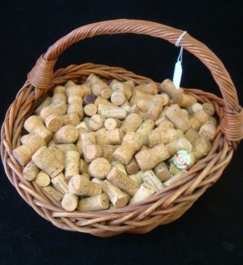 Basket Full Of Wine/Champagne Corks:: Basket Full Of Wine/Champagne Corks: Make a Cork Board, Table Top, Initials, Wreath, Picture Frame, Bath Mat, Hot Pads, Stair Risers, Planter. If Really Industrious-Pants, Blouse or Chair. In Wicker B