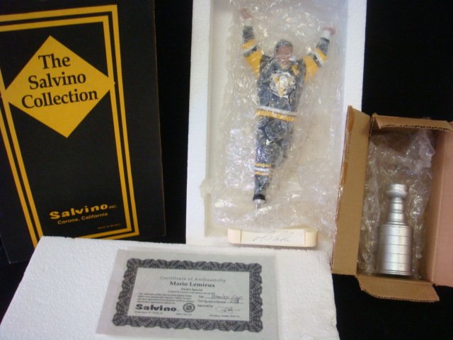 Autographed MARIO LEMIEUX Porcelain Figurine, CAO:: Autographed MARIO LEMIEUX Porcelain Figurine, CAO: "Stanley Cup" Mario Hoists the Cup, Number 253 of 368 CA 1994, With Certificate of Authenticity by Salvino Inc. (200-400)