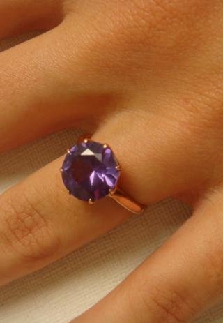 10KT Hallmarked Alexandrite Ring:: 10KT Hallmarked Alexandrite Ring: Single Round Faceted Center Stone with Weight Approximately 2.5CT. 9 Prong Cage Setting. June Birthstone with Main Deposit Source in Sri Lanka and Brazil. Size 7 1/4.