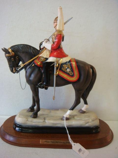 MICHAEL SUTTY, Officer Life Guards, 1980, Equestrian:: MICHAEL SUTTY, Officer Life Guards, 1980, Equestrian: Bone Porcelain Figurine of England's Premier Cavalry Unit. Modelled and Hand painted, 12" x 10" on 1" Wood Plinth with Brass Name Plate. Limited E