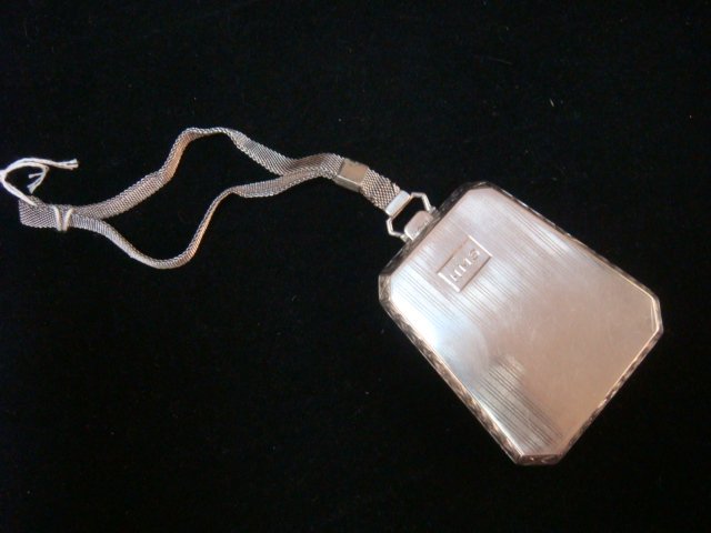 1923 Sterling Silver Coin and Card Case with Handle:: 1923 Sterling Silver Coin and Card Case with Handle: Trapezoid Shaped Case with Silver Mesh Wrist Handle. Opens to Hold Nickels and Dimes with Mirror that Lifts for Powder. Clip in Lid Marked Sterling
