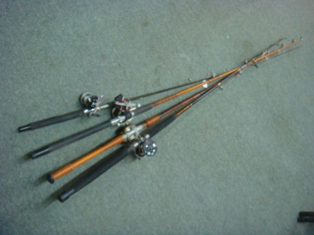 Four Vintage Fishing Rods and Reels:: Four Vintage Fishing Rods and Reels: Wood and Fiberglass Rods with Penn 9 Level Wind Reel, Penn Squidder No 140 Reel, Abu Garcia Swedish Reel and Ocean City No 112 Made in Philadelphia Reel. (100-200)