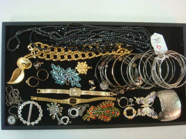 Medley of Ladies Costume Jewelry:: Medley of Ladies Costume Jewelry: Vintage Rings, Pendants, Lapel Pins, Belt Clip, ANNE KLEIN & BENRUS Watch, Embossed Cuff Bracelet, 20 Plus Bangle Bracelets, Gold Link Chain and Black Bead Necklaces.
