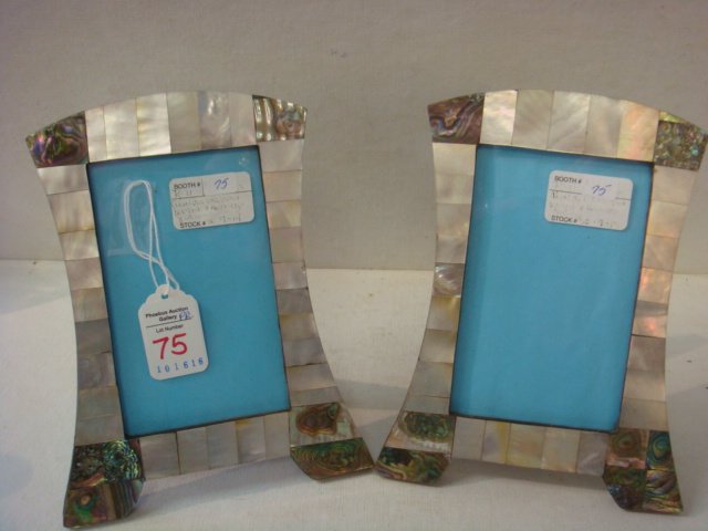 Signed Vintage Pair of Arched Top Abalone Frames:: Signed Vintage Pair of Arched Top Abalone Frames: Both Signed in French on Right Foot. Wooden Frames with Abalone Veneer and Leather Backed. 5" X 3". Art Deco(?) (100-200)