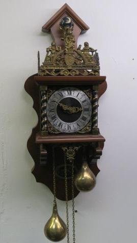 KIGA Holland Nu Elck Syn Sin Zaandam Wall Clock:: KIGA Holland Nu Elck Syn Sin Zaandam Wall Clock: From Zaan Region and of Mennonite Origin. Crown Displays Theological Virtues of Faith, Hope & Charity. Lion Represents Holland. Finial is Atlas Carryin