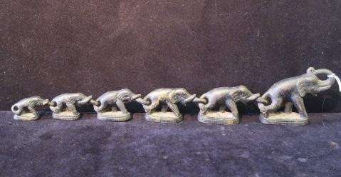 Six Bronze Thailand Elephant Opium Weights:: Six Bronze Thailand Elephant Opium Weights: Unusual Graduated Set Hook Together Trunk to Tail with Largest Having Trunk Raised. Rayed Sun Mark on Side of Base. Largest is 3 1/8"T, 554 Grams. Smallest 