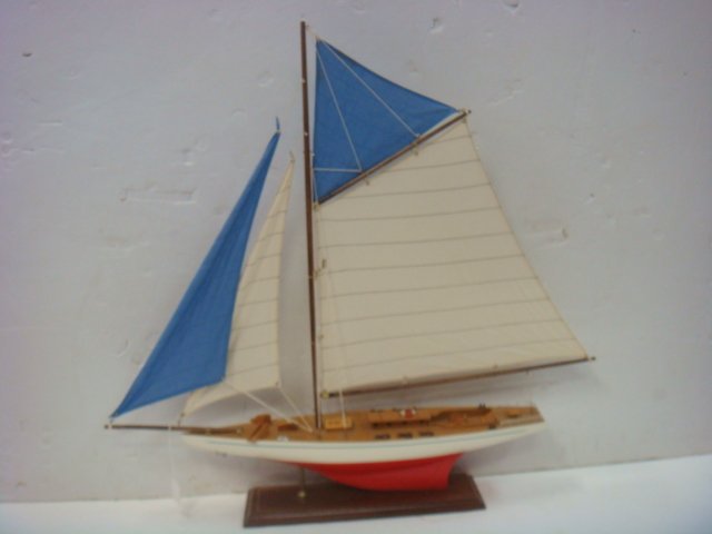 Handcrafted Model of Racing Sloop with Stand:: Handcrafted Model of Racing Sloop with Stand: Deep Keel Gaff Rigged Racing Sloop. Jib and Jenney Set with Gaff Rigged Mainsail. Cloth Sails. Deck Houses and Wenches. Very Good Condition. 30 1/2" x 33"