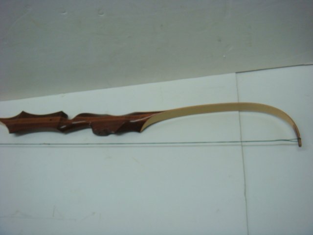 BEAR Kodiak Hunter Glass Powered Recurve Bow:: BEAR Kodiak Hunter Glass Powered Recurve Bow: CA. 1970's. 60", 45#, KT80055 Serial Number. Made in Grayling, MI. Used Condition. (200-300)