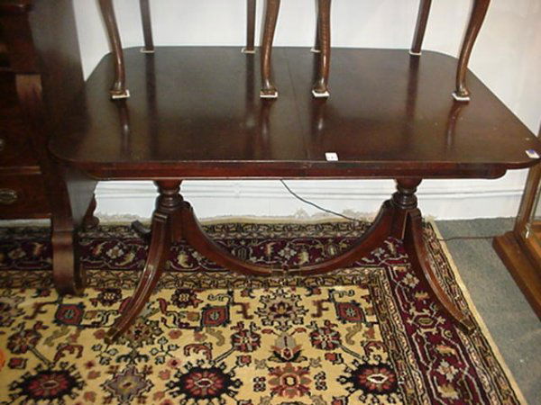 Mahogany Double Pedestal Duncan Phyfe Dining Table: Mahogany Double Pedestal Duncan Phyfe Dining TableTurned Post on Splayed Legs with Brass Cap Feet. 29"T with 4' 4" X 38" Top. Natural Patina. Has 14" Extension Leaf, Stain on Top. Buyers are reminded