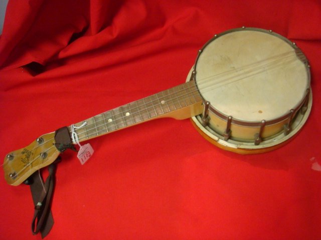 MAY BELL 4 String BANJO UKULELE by SLINGERLAND:: MAY BELL 4 String BANJO UKULELE by SLINGERLAND: Features include a 7" Birds-eye Maple Pot and Rare Resonator. Maple neck has 17 Frets. 21 1/2" long. Very Good Condition one Key Damaged. Needs new stri