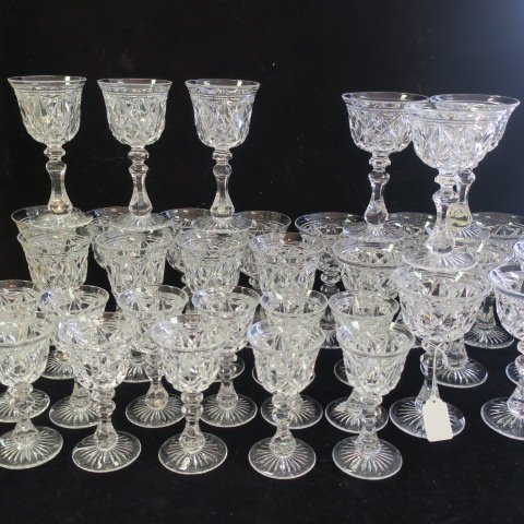 STUART Cut Crystal England Stemware-34 pcs.:: STUART Cut Crystal England Stemware-34 pcs.: Diamond and Band Pattern with Star Cut Foot. Includes Eleven 5 1/8"T Port Wines, Twelve 6 1/4"T Goblets and Eleven 6 1/2"T White Wines. (200-400)