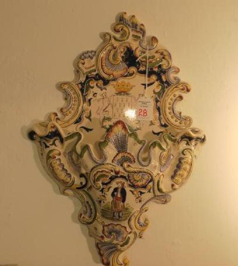 French Faience Armorial Wall Pocket:: French Faience Armorial Wall Pocket: Wall Pocket has Hand Painted Scrolls and Breton on Pocket with Coat of Arms on Back Part. 17"L, 12"W. (200-400)