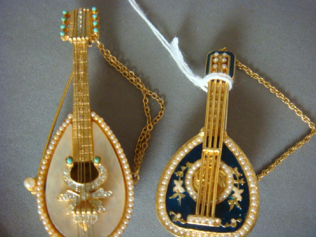Two Mandolin Ladies Brooches, One MANDLE:: Two Mandolin Ladies Brooches, One MANDLE: R Mandle (1938-1990's) Pin with Mother of Pearl Face Embellished with Imitation Seed Pearls, Turquoise & Rhinestones From 1960's Series. 3"L. Turquoise Enamel