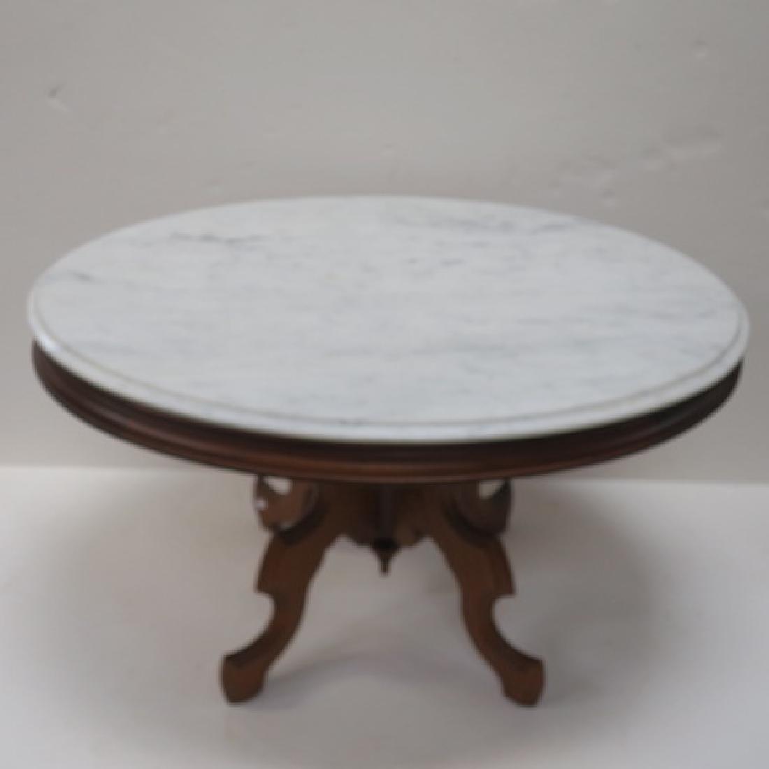 Mahogany Marble Top Oval Coffee Table:: Mahogany Marble Top Oval Coffee Table: Four Way Base with Oval Marble Top. 20"T X 34"W X 25"W. (200-400)