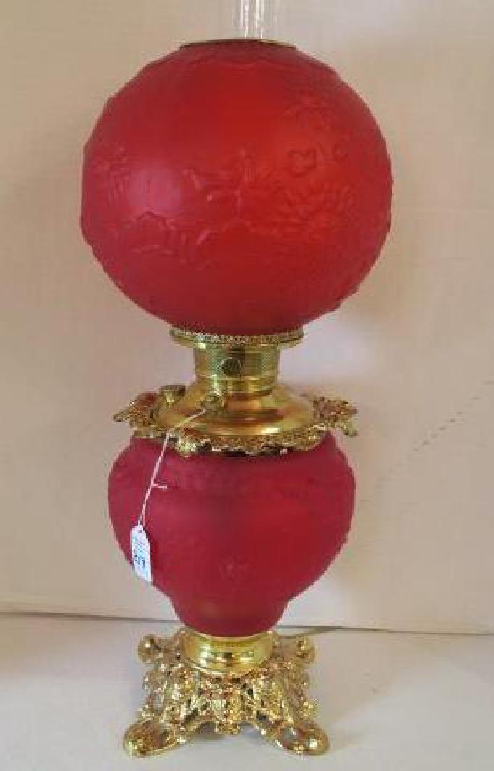 Red Satin Glass Parlor Lamp with Juno Burner:: Red Satin Glass Parlor Lamp with Juno Burner: GWTW Style Electrified Oil Lamp with Blown Out Sunflower and Rose Design on Base and Shade. Sits on Pierced Gold Metal Base. Designed by Lampmaker Edwin M