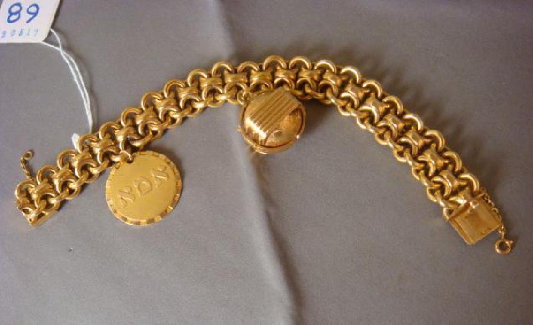 14KT Gold Bracelet with Two Charms:: 14KT Gold Bracelet with Two Charms: 3.1 Avoirdupois oz. Translated to $3300 Value. 7 1/2"L Link Chain with 14KT Hadassah Disc Charm and 4 Panel Photo 14KT Charm that Folds and Clasps into a Ball Shape