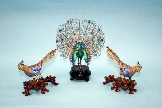 Three very good Chinesse cabinet size gilt silver: Three very good Chinesse cabinet size gilt silver figures of birds: a peacock and two others, extensively filigree worked and enamelled bodies, fitted on a carved wood display stand. Hallmarked. Circa