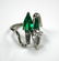 402: A hand made platinum, emerald and diamond ring of