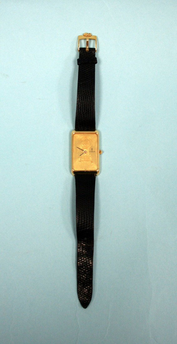 CORUM, Switzerland - An attractive gold watch. Mov: CORUM, Switzerland - An attractive gold watch. Movement in a rectangular case in form of a 999 pure gold Swiss Argor Chiasso gold bar, 15 grms. Diamond set winder, original Corum leather strap.