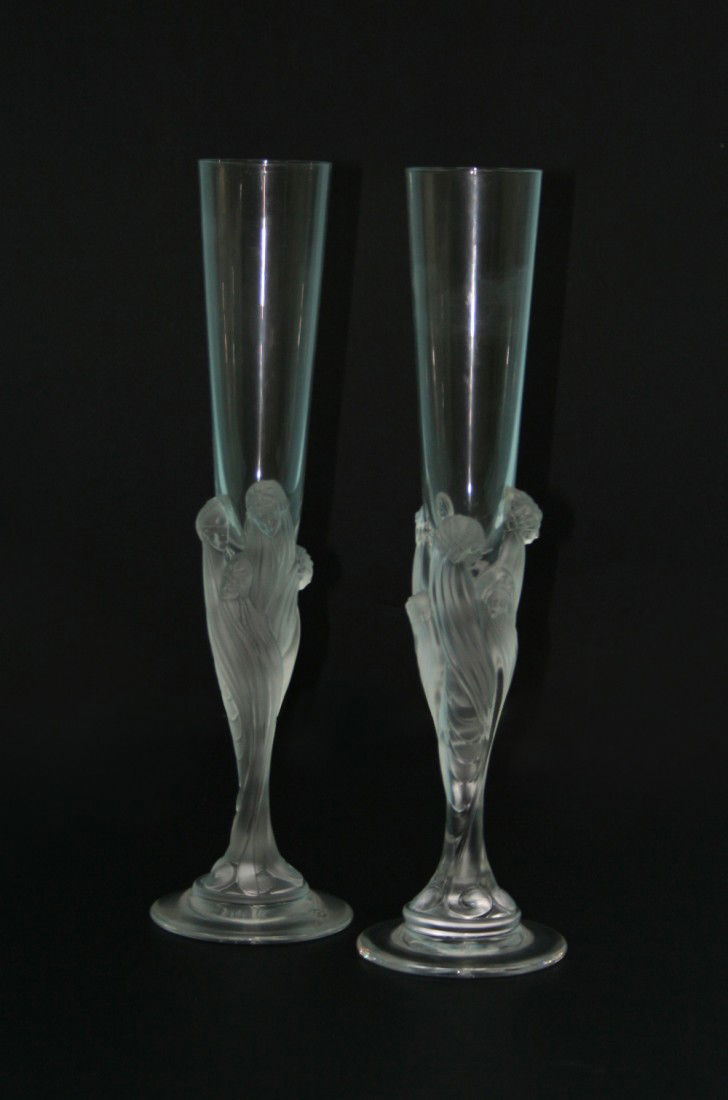 ERTE, FRANCE - "Flute Majestique". A pair of : ERTE, FRANCE - "Flute Majestique". A pair of unusual French crystal champagne glasses. The long fluted glasses supported by finely formed group of young women. 11 3/4" high. Signed underside.
