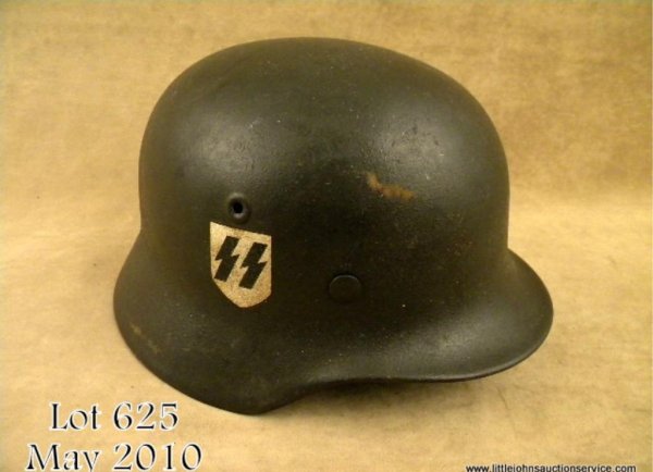 Waffen SS M40 single decal combat helmet retains : Waffen SS M40 single decal combat helmet retains original Waffen SS decal on the helmet's right side. Complete with original liner and chinstrap. Est: $1,500 - $3,000
