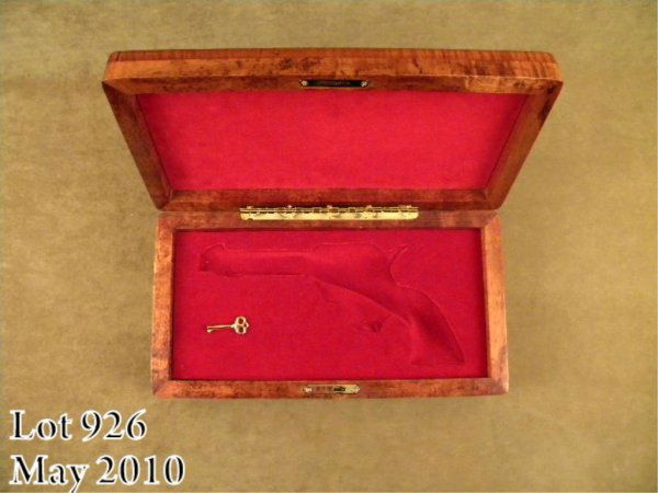 Highly custom exotic wood display case for a Colt: Highly custom exotic wood display case for a Colt SAA 5-1/2" barrel in overall excellent condition; this display case is made of fiddle back Koa wood from Kona, Hawaii with the top of the lid inlaid w