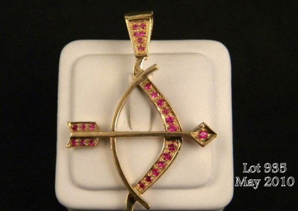 One bow and arrow pendant set with 25 rubies(appr: One bow and arrow pendant set with 25 rubies(approx. wt 1.5ct.) set in 14kt yellow gold (wt.13.37gms). Est. $500-$1,750.