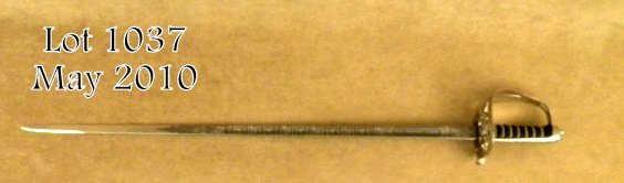 Scot's Guards officer's pattern sword by Wilkins: Scot's Guards officer's pattern sword by Wilkinson. Finely etched with battle honors of WWII, #113046 on spine. Named to purchaser, "John Preston Hansen". Very finely made and expensive commemorative 