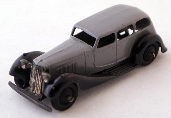 Unboxed Dinky # 36a Armstrong Siddeley. Grey with: Unboxed Dinky # 36a Armstrong Siddeley. Grey with Black moulded chassis and Black ridged hubs. Mint unboxed.