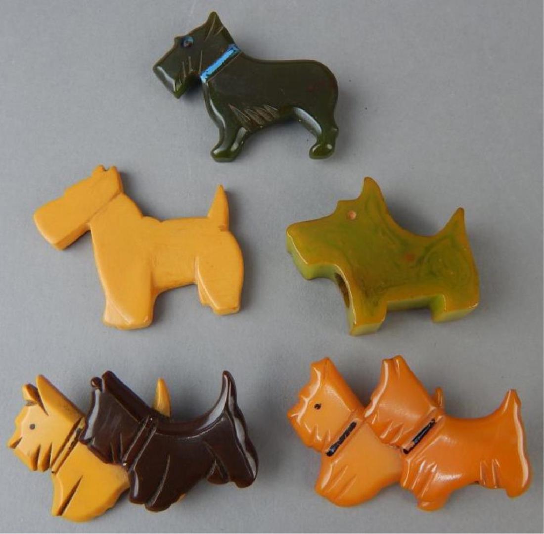 Bakelite Collection of Scottie Dogs: Includes four brooches one missing back pin, two are unusual double dogs & one pencil sharpener. Estimate $300 - $400. Starting bid $30.