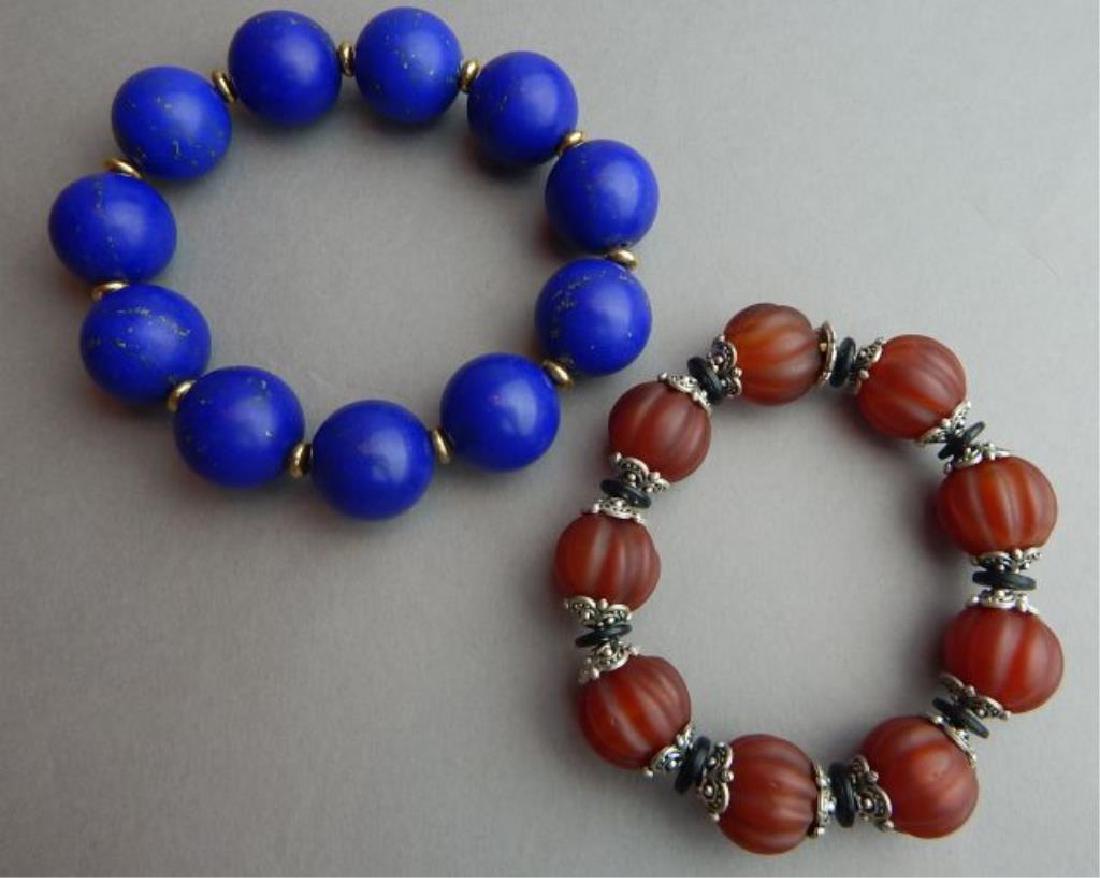 Lapis and Nan Hong Pumpkin Bead Bracelets: Lapis measures 3 1/2" and Nan Hong 3". Estimate $150 = $250. Starting bid $30.