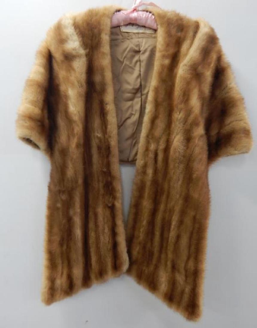 Tan Mink Shoulder Wrap: From Graf's Furs, San Diego. Stitching on one pocket has come loose. Estimate $300 - $400. Starting bid $20.