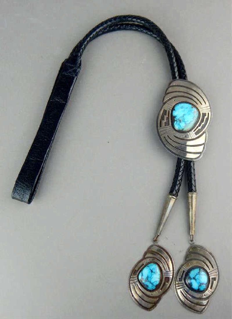 Native American Sterling and Turquoise Bolo Tie: Hopi artist signed with symbol for Victor Coochwytewa. Estimate $300 - $500 Starting Bid $50