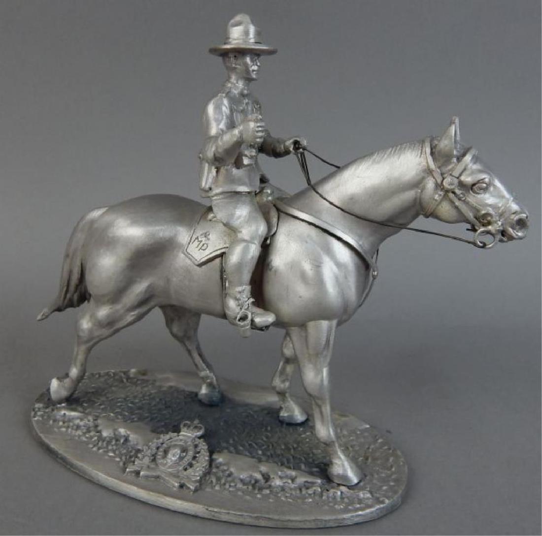 Canadian Mounted Police On Horse: Marked M.P. & Slaukodugar Canada". Probably solid lead. Measures 6 1/4" x 7 3/4". Estimate $100 - $200. Starting bid $40.