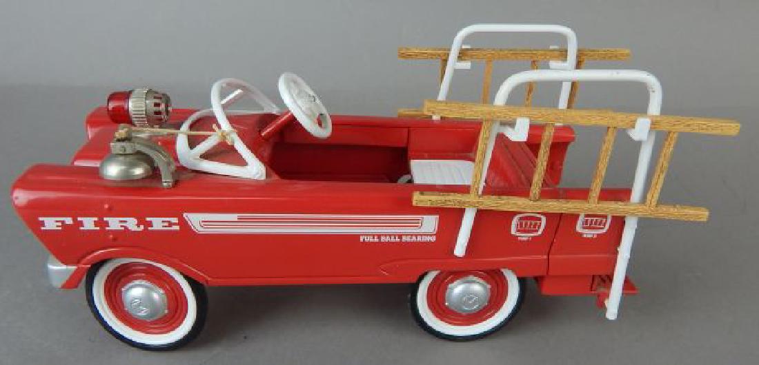 Battery-op Die Cast Fire Truck: With two wooden ladders. Measures 7 1/2". Estimate $100 - $200. Starting bid $20.
