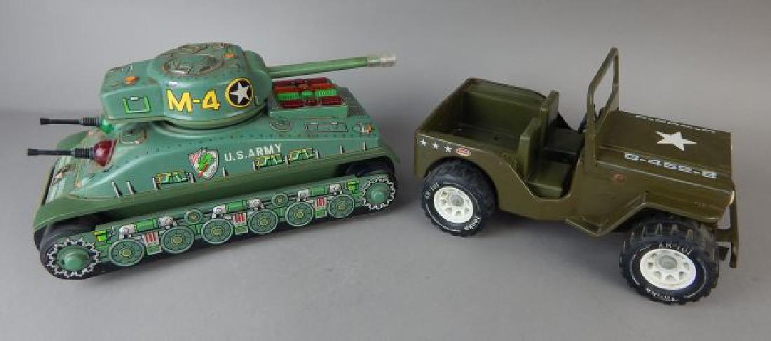 Green Tonka Jeep and Tin Tank: Jeep measures 10". Tank is battery-operated measuring 11 1/2". Estimate $100 - $200. Starting bid $20.