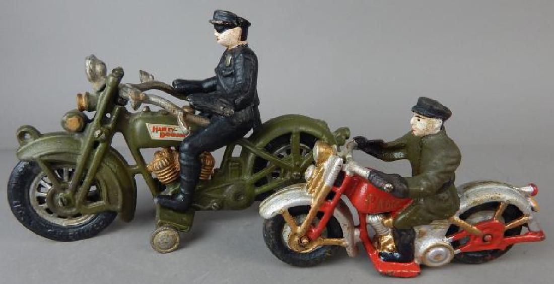 Two Cast Iron Motorcycles: Includes green Harley Davidson 5 1/2" x 8 1/2" and a red motorcycle made in China 4" x 6 1/4". Estimate $200 - $300. Starting bid $30.