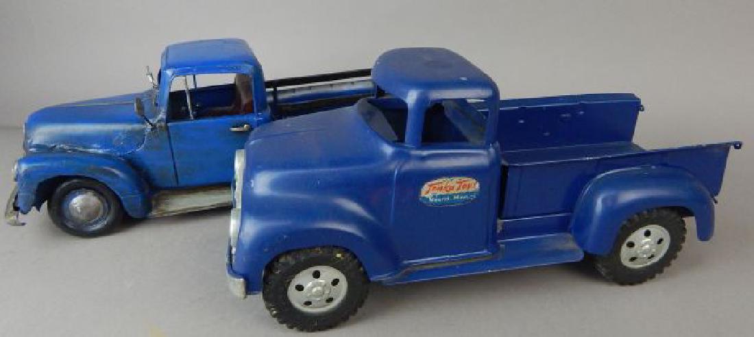Two Vintage Blue Trucks: Tonka truck measures 12 1/2" and the other truck measures 13". Estimate $200 - $300. Starting bid $30.
