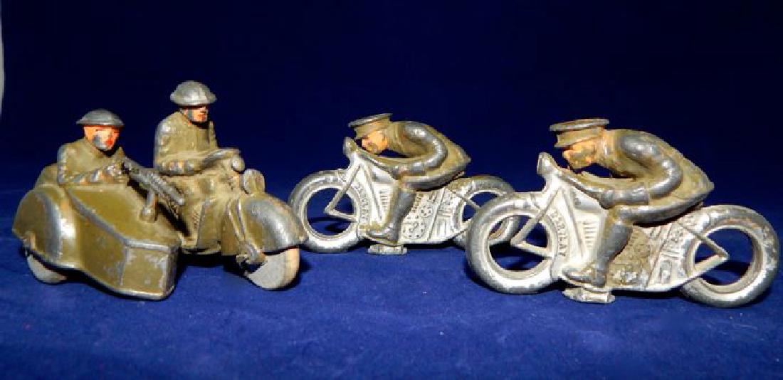 Vintage Barclay Toy Soldiers on Motorcycles: Total of 3 pieces. Includes Manoil grey lead toy soldiers on motorcycles, and two soldiers on motorcycle with sidecar. Made in USA. Measures approx. 2 1/2" x 3 1/2". Estimate $200 - $300 Starting Bid 