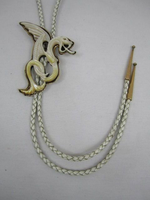 A3-27 STERLING & GOLD BOLO TIE: Artist signed "Dragon at the hearts door" Winston '93. With mother of pearl, sterling and gold with leather rope.