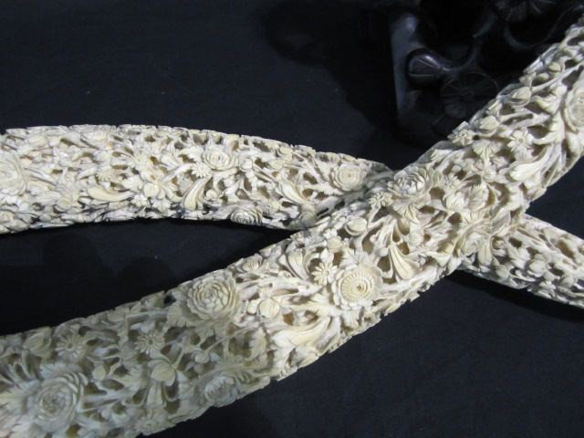 A18-25 PAIR OF CHINESE IVORY CARVED TUSKS: Magnificent pair carved floral pattern, original wood bases, some loss on bases. Both horns in very good condition with minor age cracks near top. Canton carvings circa 1880-1890.