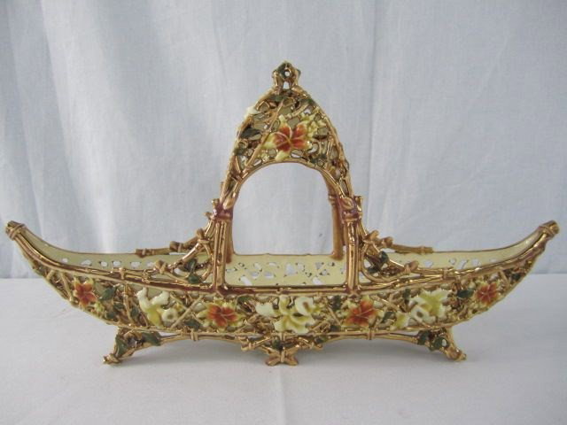 A18-18 ZSOLNAY RETICULATED BOAT: Five towers mark on bottom 19th century very unusual form; small chip on one foot.
